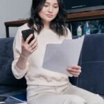 Woman reading documents about a default judgment for debt